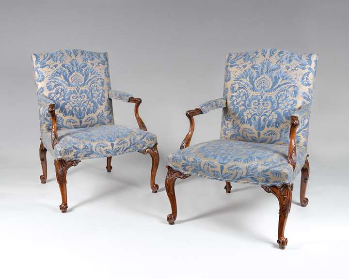 An exceptional PAIR of finely carved walnut Gainsborough armchairs